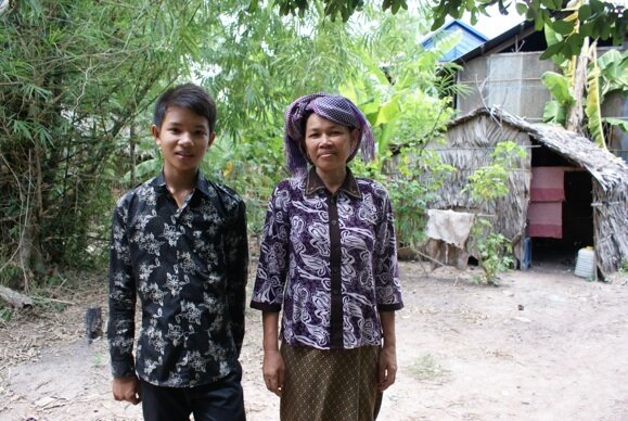 High school student with his mother, O Russei village, Kampong Chhnang province